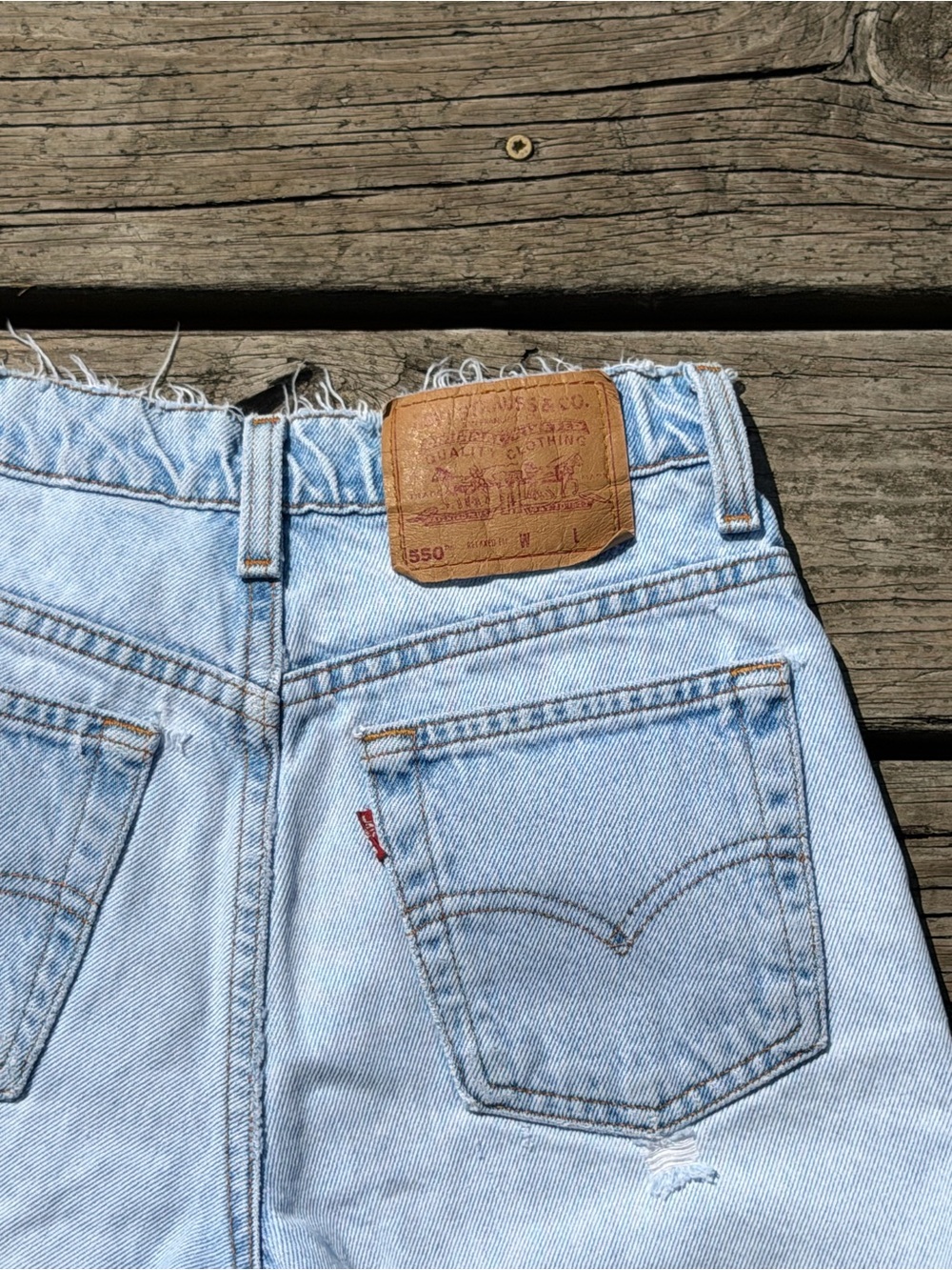 Levi's 550 Light Wash Denim Cutoff Shorts with Leather Patch